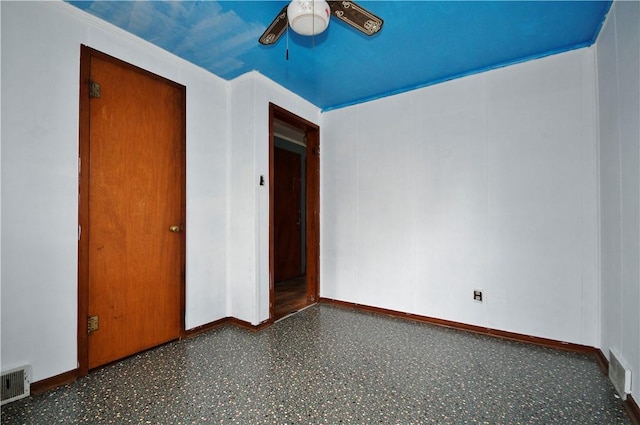unfurnished bedroom with ceiling fan, baseboards, and visible vents