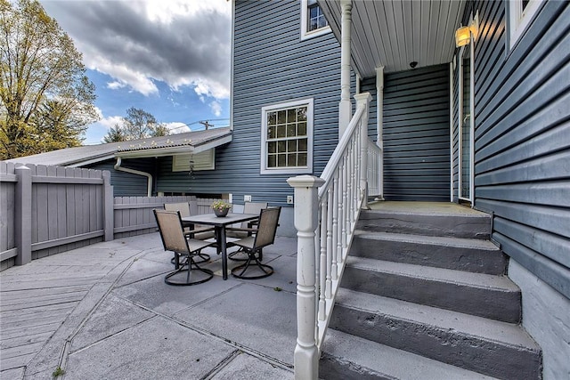 view of patio / terrace featuring fence and outdoor dining area