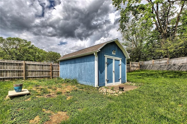 view of shed with a fenced backyard