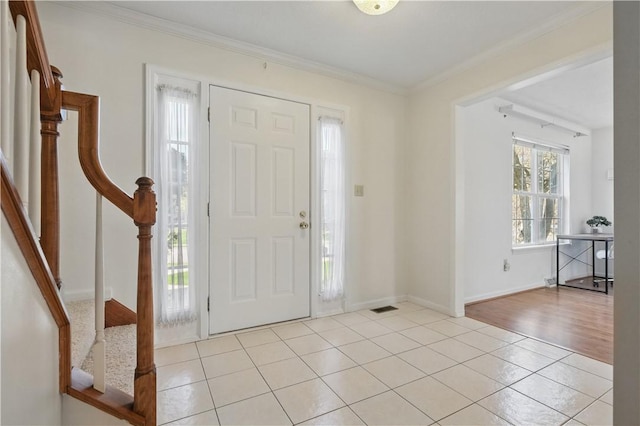 827 Brookfield Dr, Seven Fields Boro, PA 16046 - foyer with light tile patterned floors, stairway, ornamental molding, and baseboards