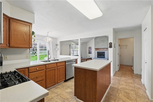 827 Brookfield Dr, Seven Fields Boro, PA 16046 - kitchen with a sink, dishwasher, light countertops, a brick fireplace, and a textured ceiling