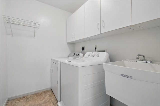 827 Brookfield Dr, Seven Fields Boro, PA 16046 - laundry area with cabinet space, washer and clothes dryer, and baseboards