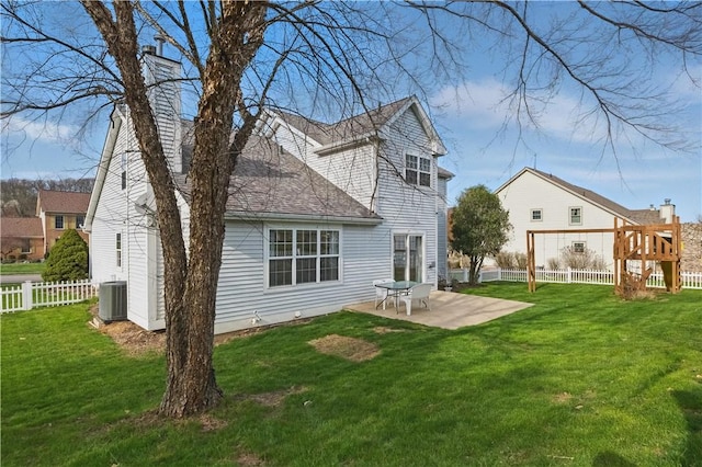 827 Brookfield Dr, Seven Fields Boro, PA 16046 - back of property featuring a patio area, central AC, a chimney, and roof with shingles
