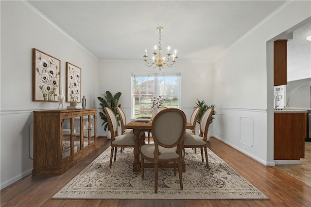 827 Brookfield Dr, Seven Fields Boro, PA 16046 - dining room featuring a chandelier, ornamental molding, and wood finished floors