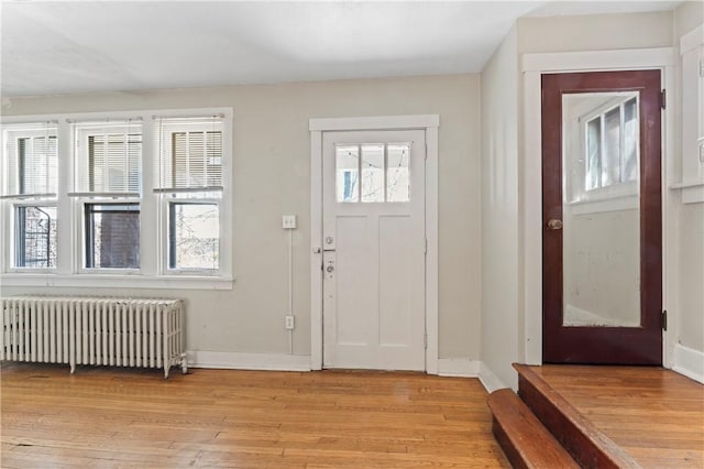 2006 Locust St, Swissvale, PA 15218 - entrance foyer featuring radiator heating unit, light wood-style floors, and baseboards