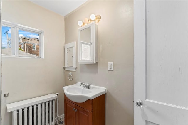 2006 Locust St, Swissvale, PA 15218 - bathroom featuring radiator and vanity