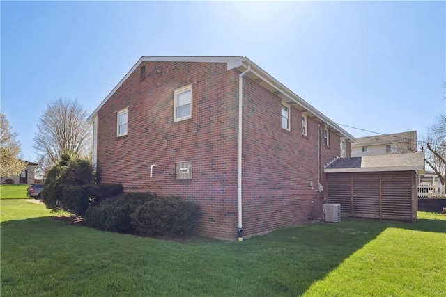 view of property exterior featuring a lawn and brick siding