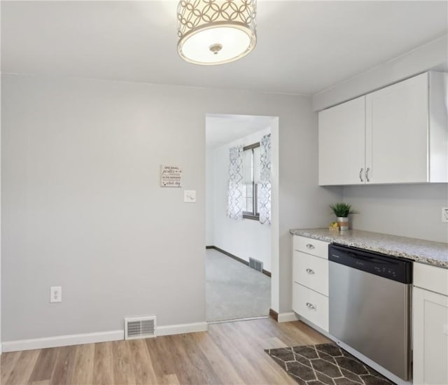 kitchen featuring dishwasher, white cabinetry, visible vents, and light wood-type flooring