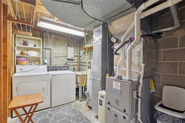 clothes washing area featuring washing machine and clothes dryer and laundry area
