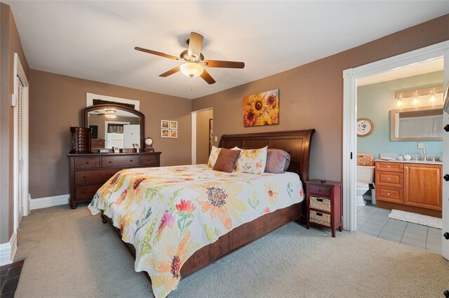 1 Alton Dr, Bethel Park, PA 15102 - carpeted bedroom with baseboards, connected bathroom, and ceiling fan