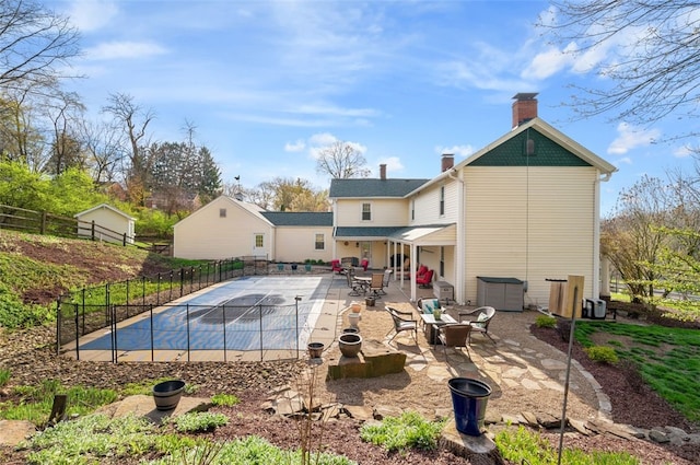 1 Alton Dr, Bethel Park, PA 15102 - back of property featuring a fenced in pool, a patio, a chimney, and fence