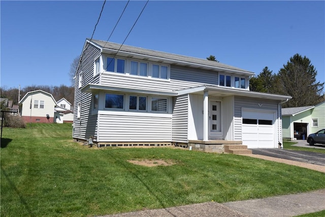 traditional-style home featuring a front lawn, aphalt driveway, and a garage