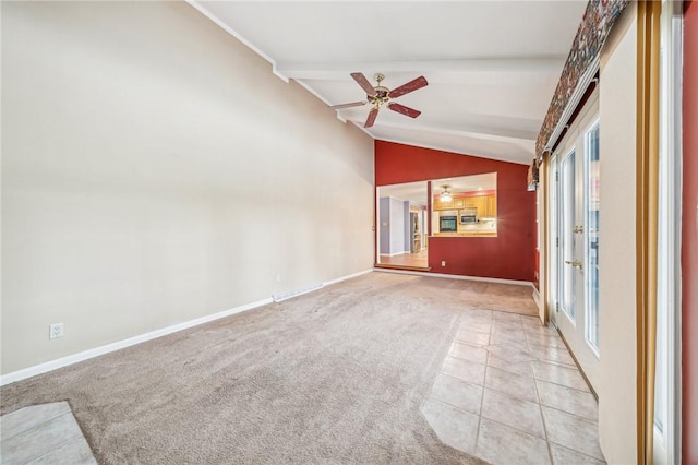 spare room featuring a ceiling fan, vaulted ceiling with beams, visible vents, and a healthy amount of sunlight