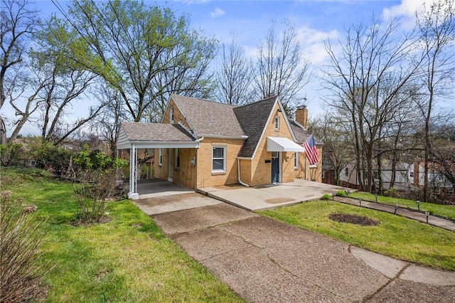 211 Wainwright Ave, Brentwood, PA 15227 - view of front of home with a chimney, concrete driveway, brick siding, a shingled roof, and a front yard