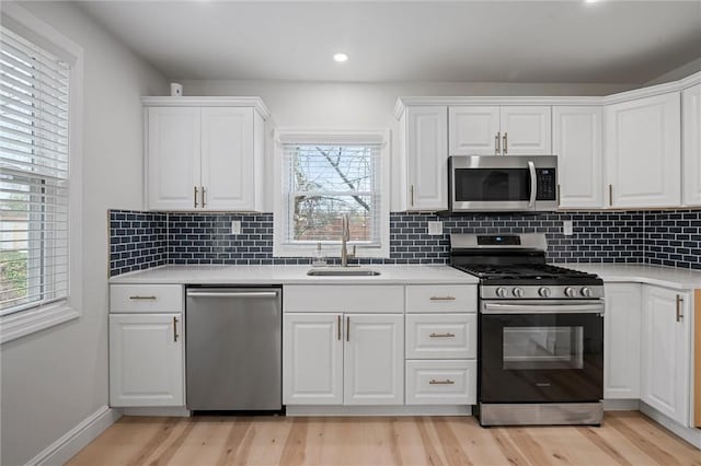 211 Wainwright Ave, Brentwood, PA 15227 - kitchen with light countertops, plenty of natural light, appliances with stainless steel finishes, and a sink