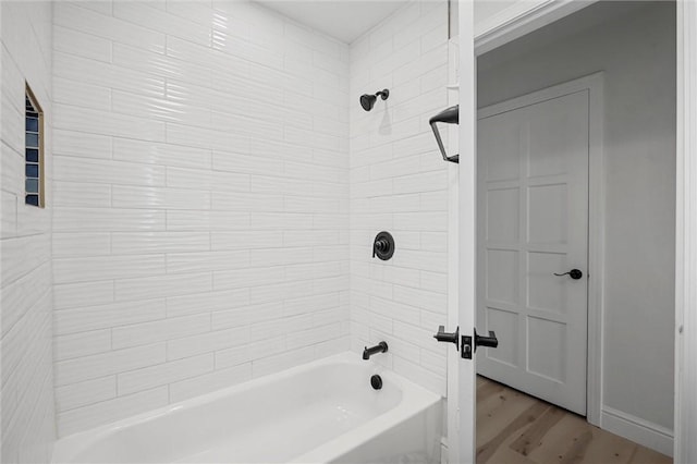 211 Wainwright Ave, Brentwood, PA 15227 - bathroom featuring washtub / shower combination and wood finished floors