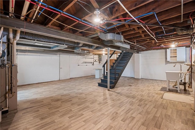 211 Wainwright Ave, Brentwood, PA 15227 - unfinished below grade area with wood finished floors, stairs, and a sink