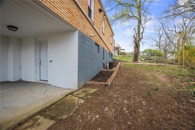 211 Wainwright Ave, Brentwood, PA 15227 - view of side of home with cooling unit and concrete block siding