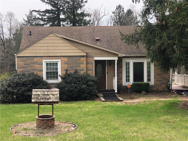 159 Oakville Rd, Chippewa Twp, PA 15010 - view of front facade featuring roof with shingles, stone siding, and a front lawn