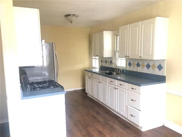 159 Oakville Rd, Chippewa Twp, PA 15010 - kitchen featuring a sink, dark wood-style floors, baseboards, and range with gas stovetop