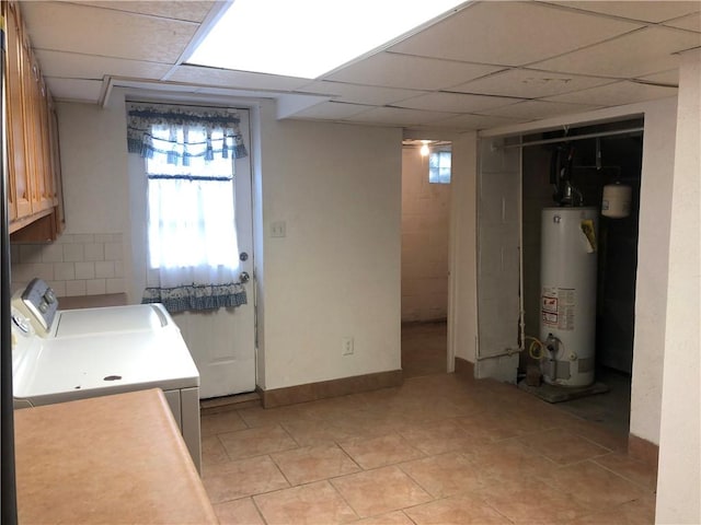 159 Oakville Rd, Chippewa Twp, PA 15010 - basement with water heater, washer and dryer, a drop ceiling, and light tile patterned floors