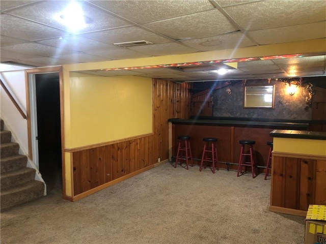 159 Oakville Rd, Chippewa Twp, PA 15010 - finished basement featuring a dry bar, carpet floors, a drop ceiling, stairs, and wooden walls