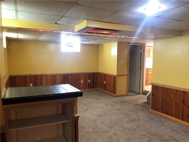 159 Oakville Rd, Chippewa Twp, PA 15010 - below grade area with wainscoting, light colored carpet, wooden walls, and a paneled ceiling