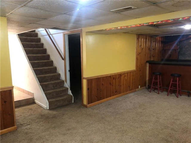 159 Oakville Rd, Chippewa Twp, PA 15010 - finished basement featuring a bar, stairway, wood walls, carpet flooring, and a drop ceiling