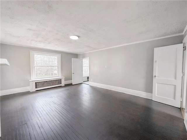 unfurnished living room featuring crown molding, a textured ceiling, radiator, dark wood finished floors, and baseboards