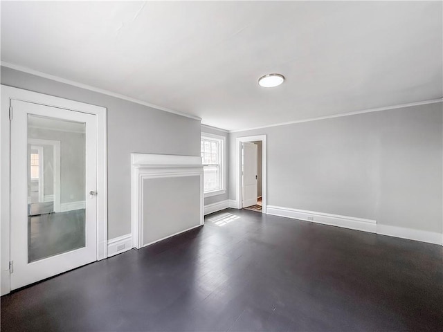 unfurnished living room featuring baseboards and crown molding