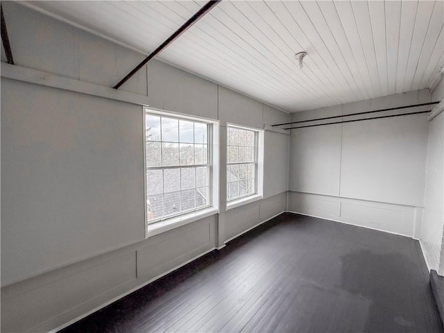 walk in closet with dark wood-style flooring
