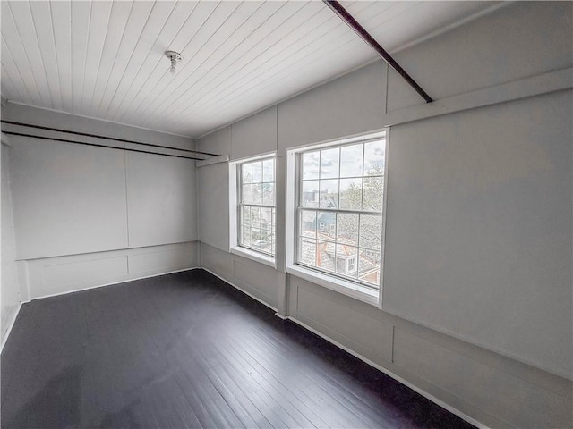unfurnished room featuring dark wood-style flooring