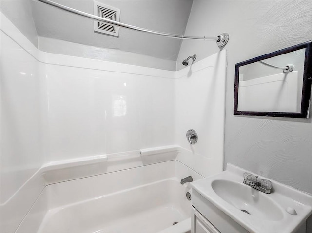 full bathroom with shower / washtub combination and vanity