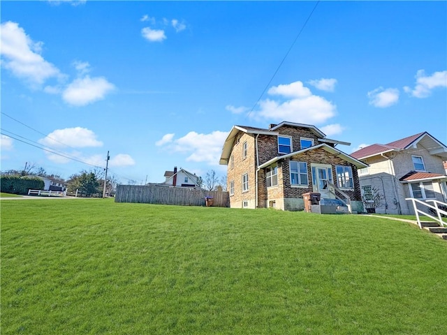 100 Shenango Blvd, Farrell, PA 16121 - back of house featuring brick siding, a lawn, stone siding, and fence