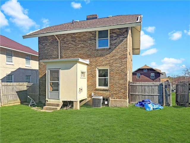 100 Shenango Blvd, Farrell, PA 16121 - back of property featuring a lawn, a fenced backyard, entry steps, and brick siding