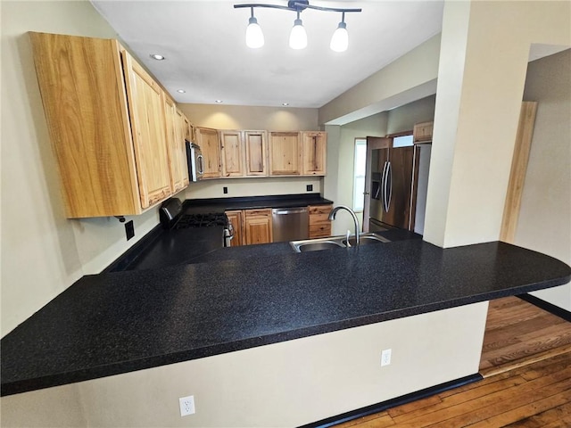 100 Shenango Blvd, Farrell, PA 16121 - kitchen featuring light brown cabinets, dark countertops, a sink, stainless steel appliances, and a peninsula