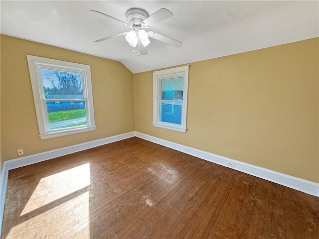 100 Shenango Blvd, Farrell, PA 16121 - spare room with wood-type flooring, vaulted ceiling, a ceiling fan, and baseboards