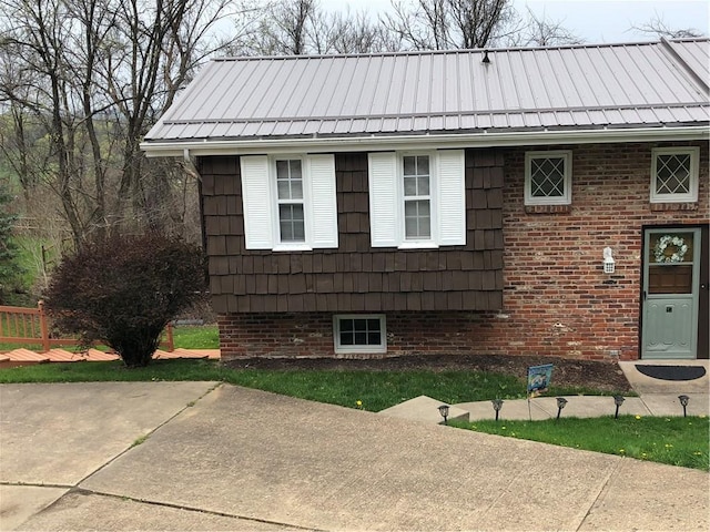 exterior space featuring brick siding