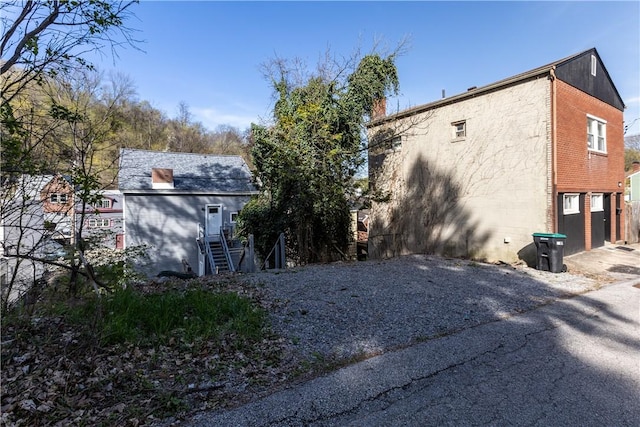 833 Stanton Ave, Millvale, PA 15209 - view of property exterior with driveway and stairway