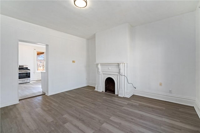 216 Ridge Ave, New Kensington, PA 15068 - unfurnished living room featuring baseboards, wood finished floors, and a fireplace