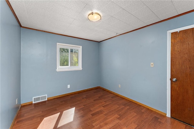 2925 Mcneal Rd, Hampton, PA 15101 - empty room featuring baseboards, crown molding, wood finished floors, and visible vents