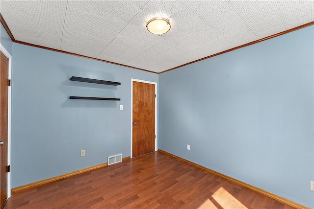 2925 Mcneal Rd, Hampton, PA 15101 - unfurnished room with baseboards, ornamental molding, wood finished floors, and visible vents