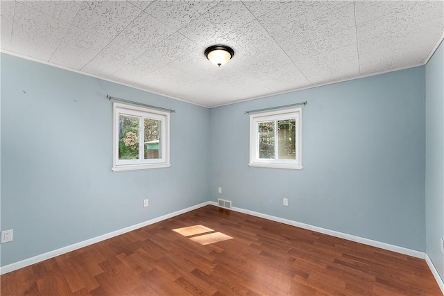 2925 Mcneal Rd, Hampton, PA 15101 - empty room with wood finished floors, a healthy amount of sunlight, and visible vents