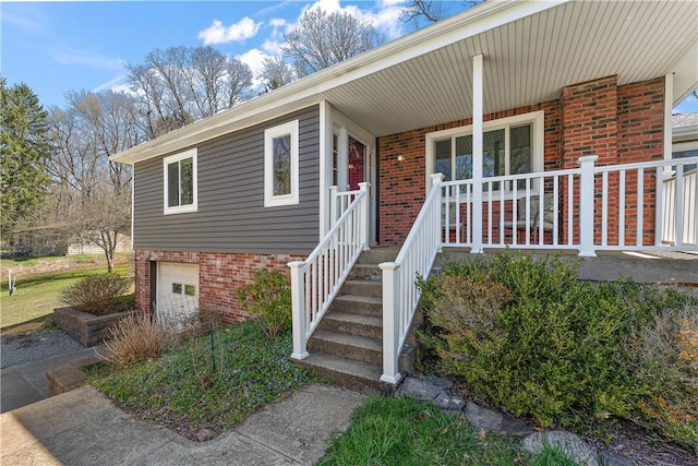 2925 Mcneal Rd, Hampton, PA 15101 - entrance to property featuring brick siding, a garage, and covered porch