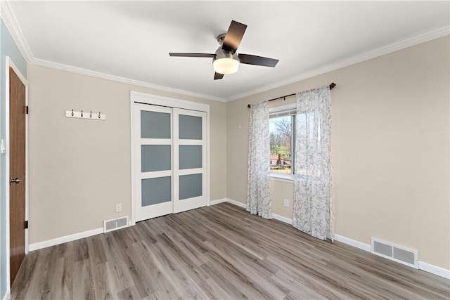 2925 Mcneal Rd, Hampton, PA 15101 - unfurnished room featuring wood finished floors, visible vents, and crown molding