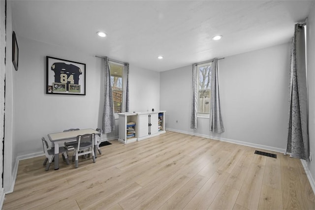 interior space with light wood-style flooring, recessed lighting, and a healthy amount of sunlight