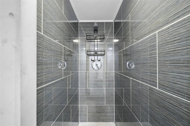 bathroom with tiled shower