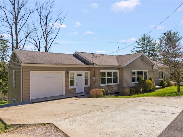 320 Parcell St, Claysville, PA 15323 - ranch-style house with a garage, roof with shingles, and concrete driveway