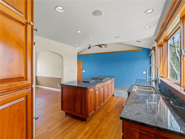 320 Parcell St, Claysville, PA 15323 - kitchen with light wood-style flooring, arched walkways, a sink, baseboards, and recessed lighting