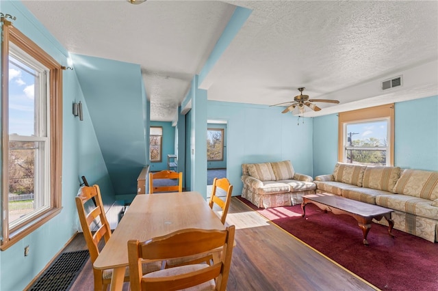 335 Queensbury Steet, Crafton Heights, PA 15205 - living area with wood finished floors, a textured ceiling, plenty of natural light, and visible vents